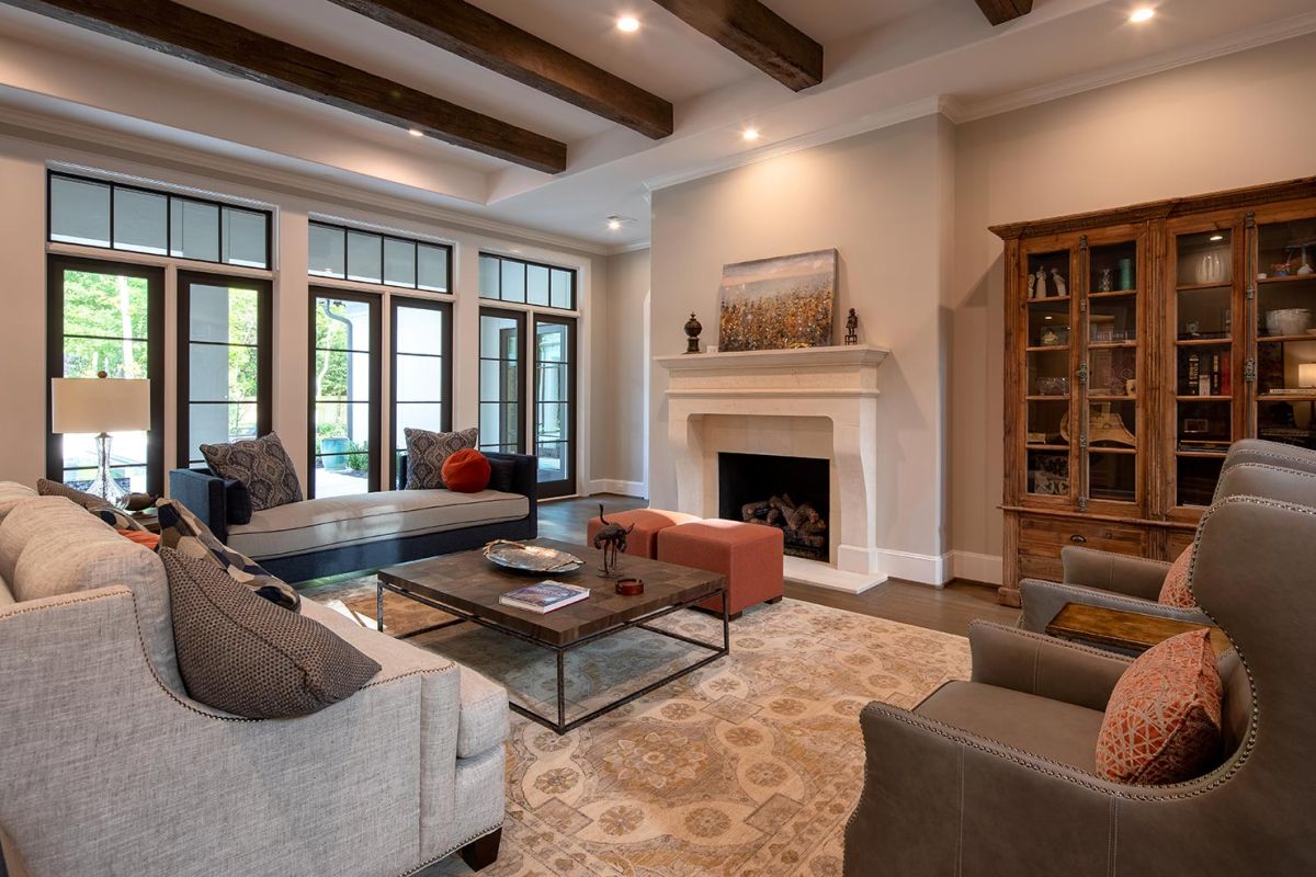 Sophisticated living room with fireplace and wood beams