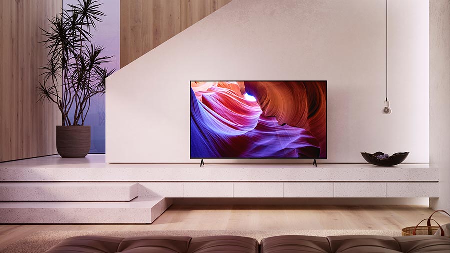 Minimalist living room with Sony TV on a white media console