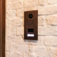 metallic finish door entry station by the front door of a residence.