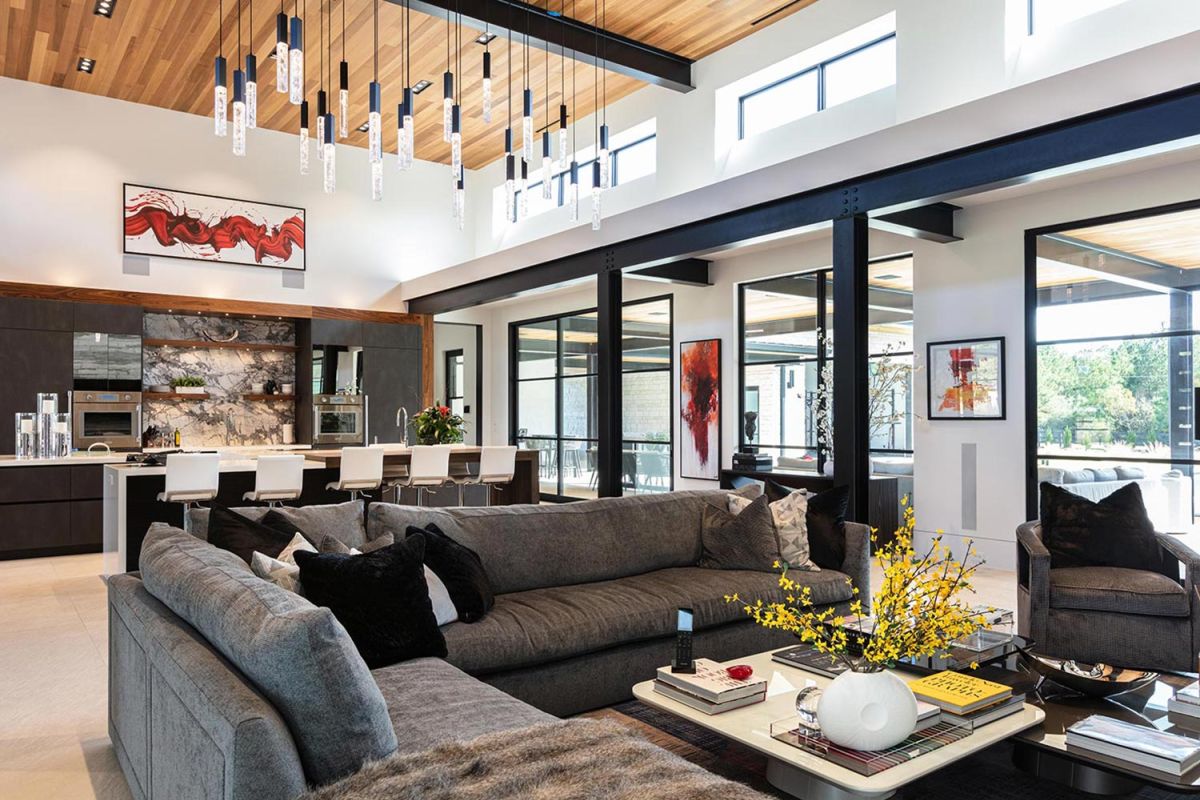 Living room with grey sectional sofa and modern pendant lights